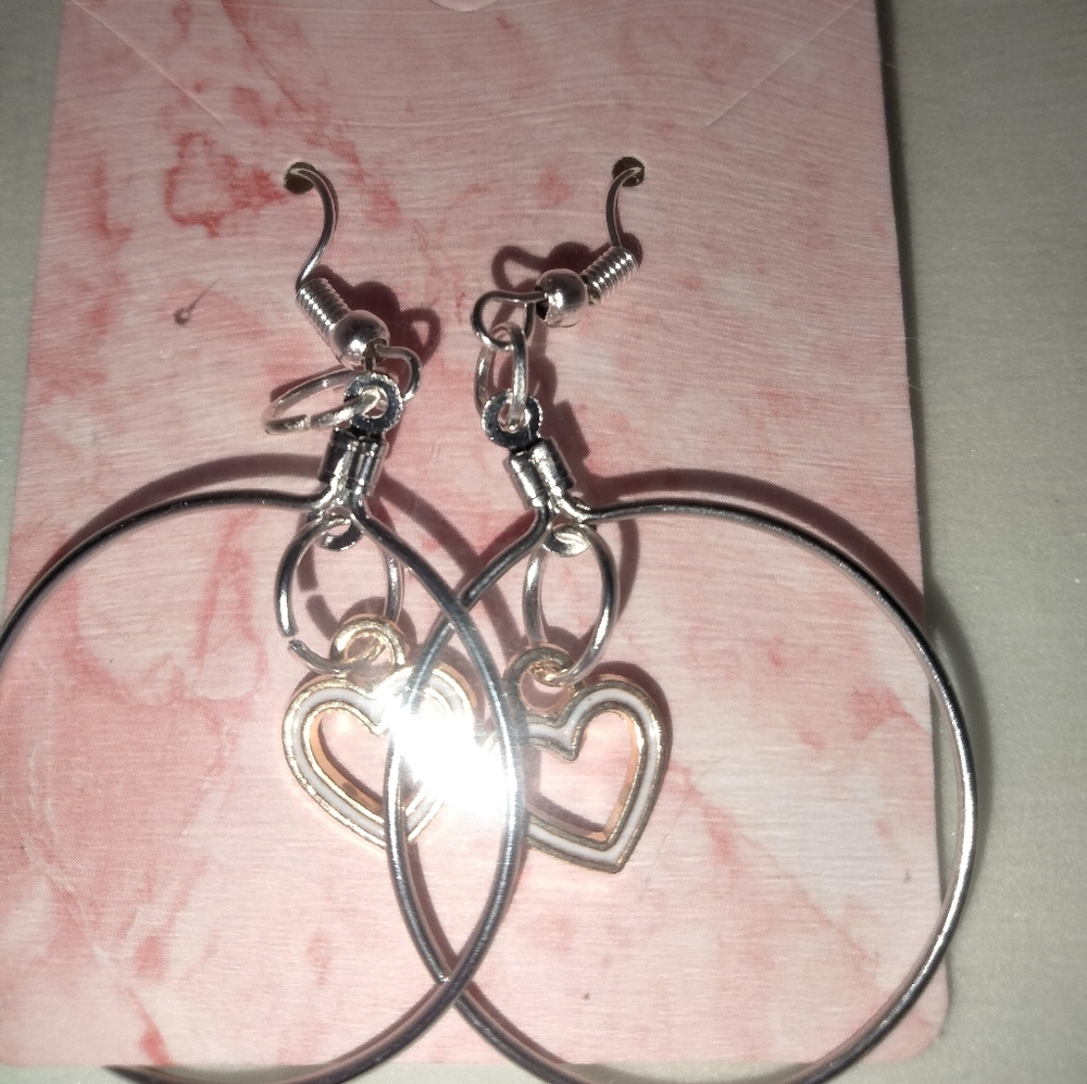White hearts inside of the sterling silver hoop